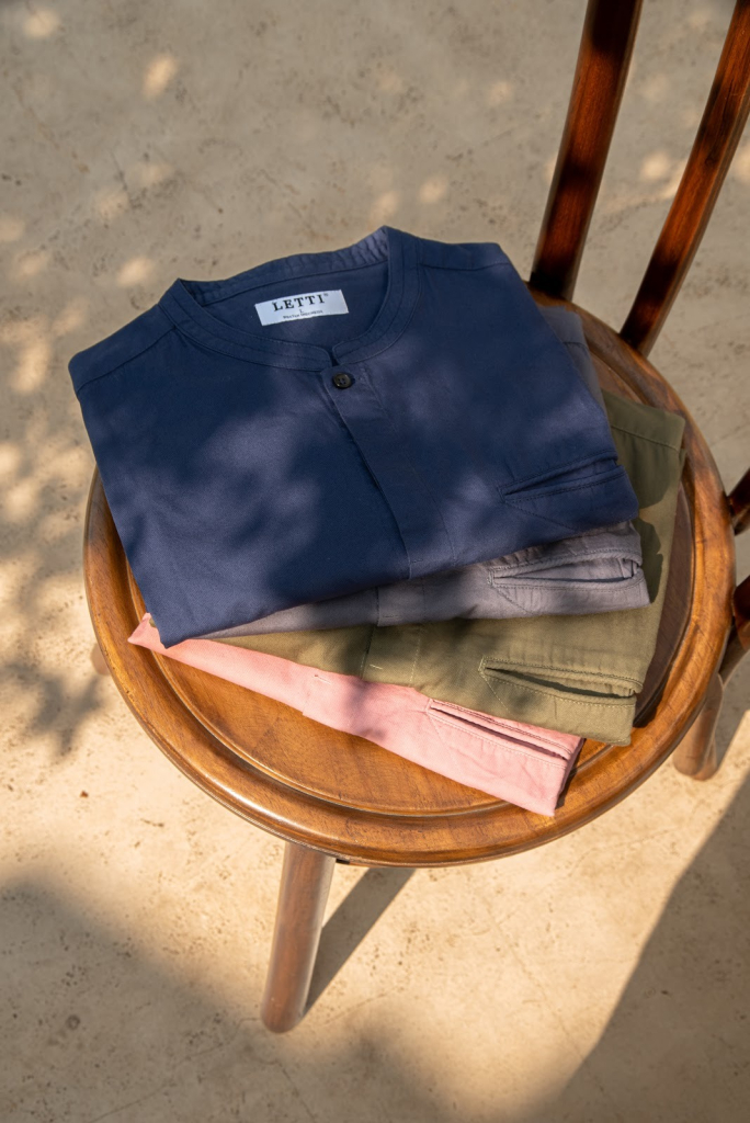 Foto flatlay Capsule 1 LETTI full-width berkualitas sinematik